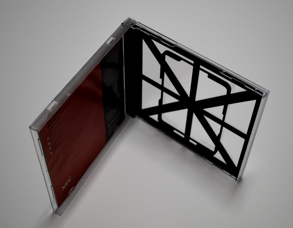 CD case with a TurboGrafx-16 instruction manual and 3D printed HuCard tray